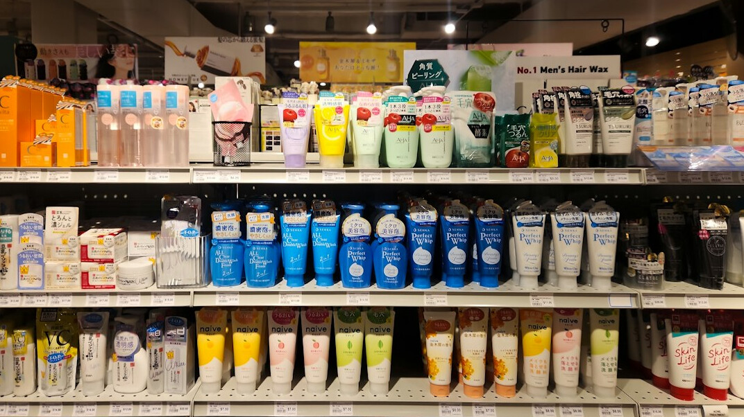 woman shoplifting cosmetics in store