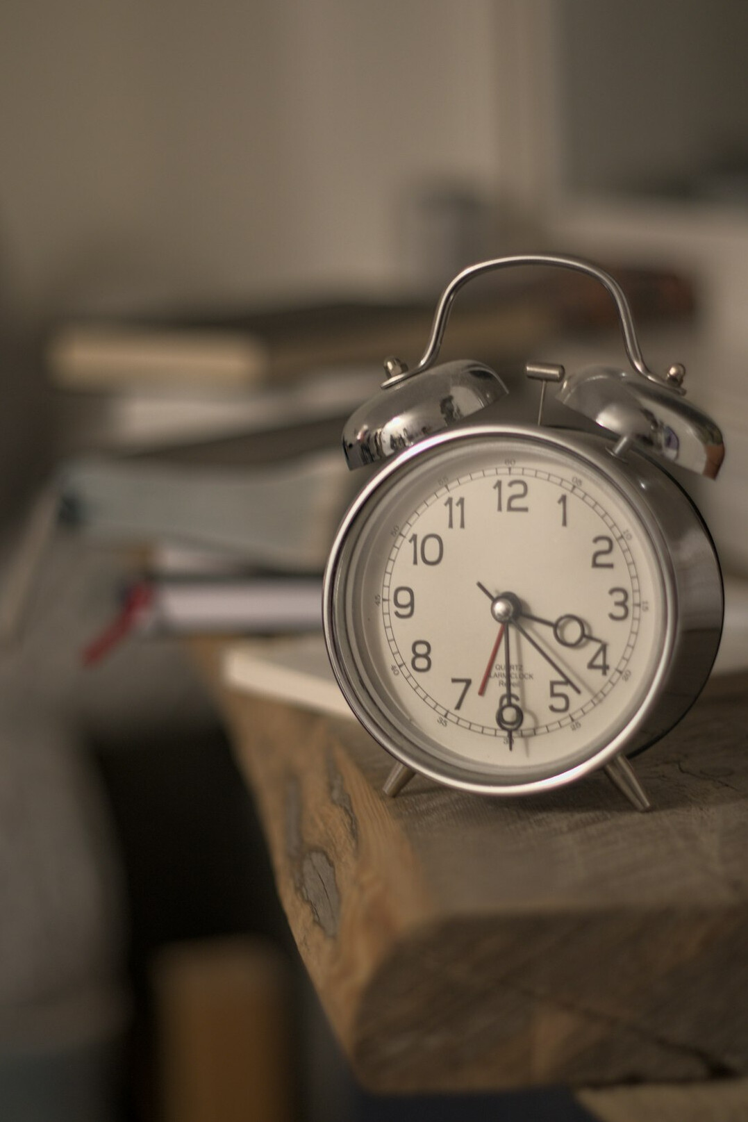 Antique clock and a bundle of old sealed letters on a writing desk